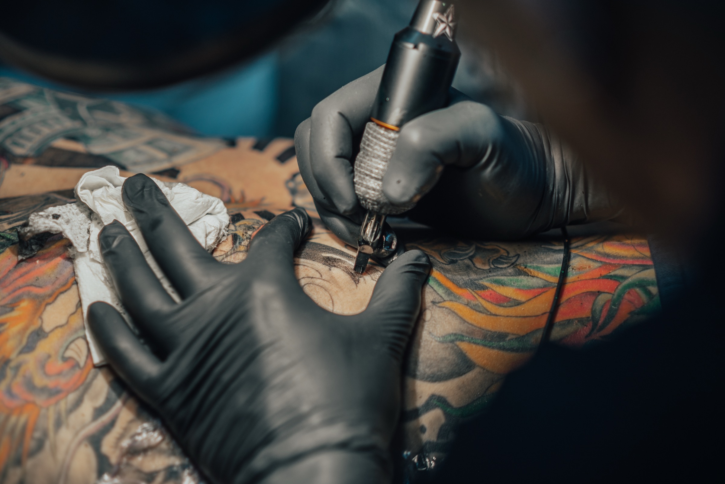 Close-up of a tattoo machine at work